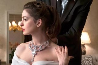 Anne Hathaway wears jewels around her neck and a gown in 'Ocean's 8'