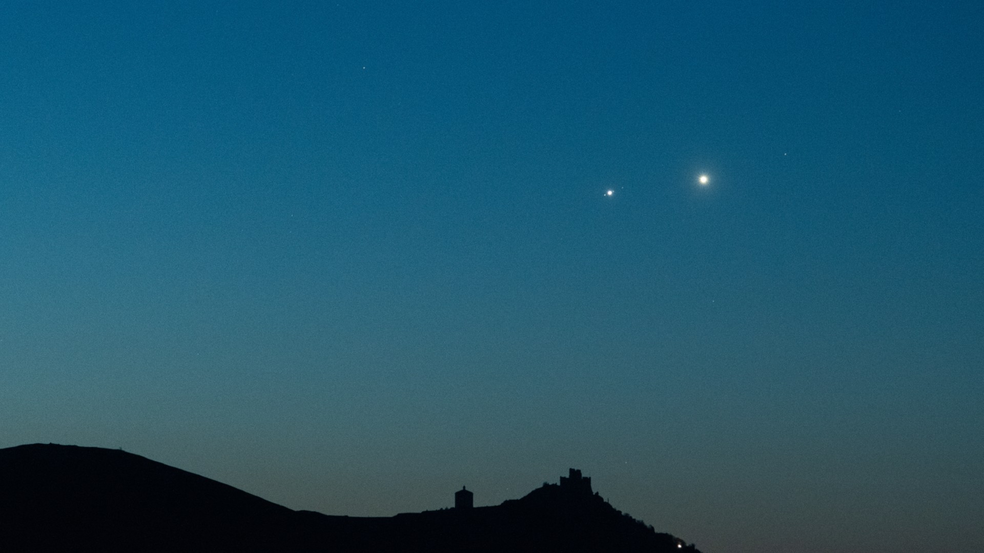 two bright dots in the night sky
