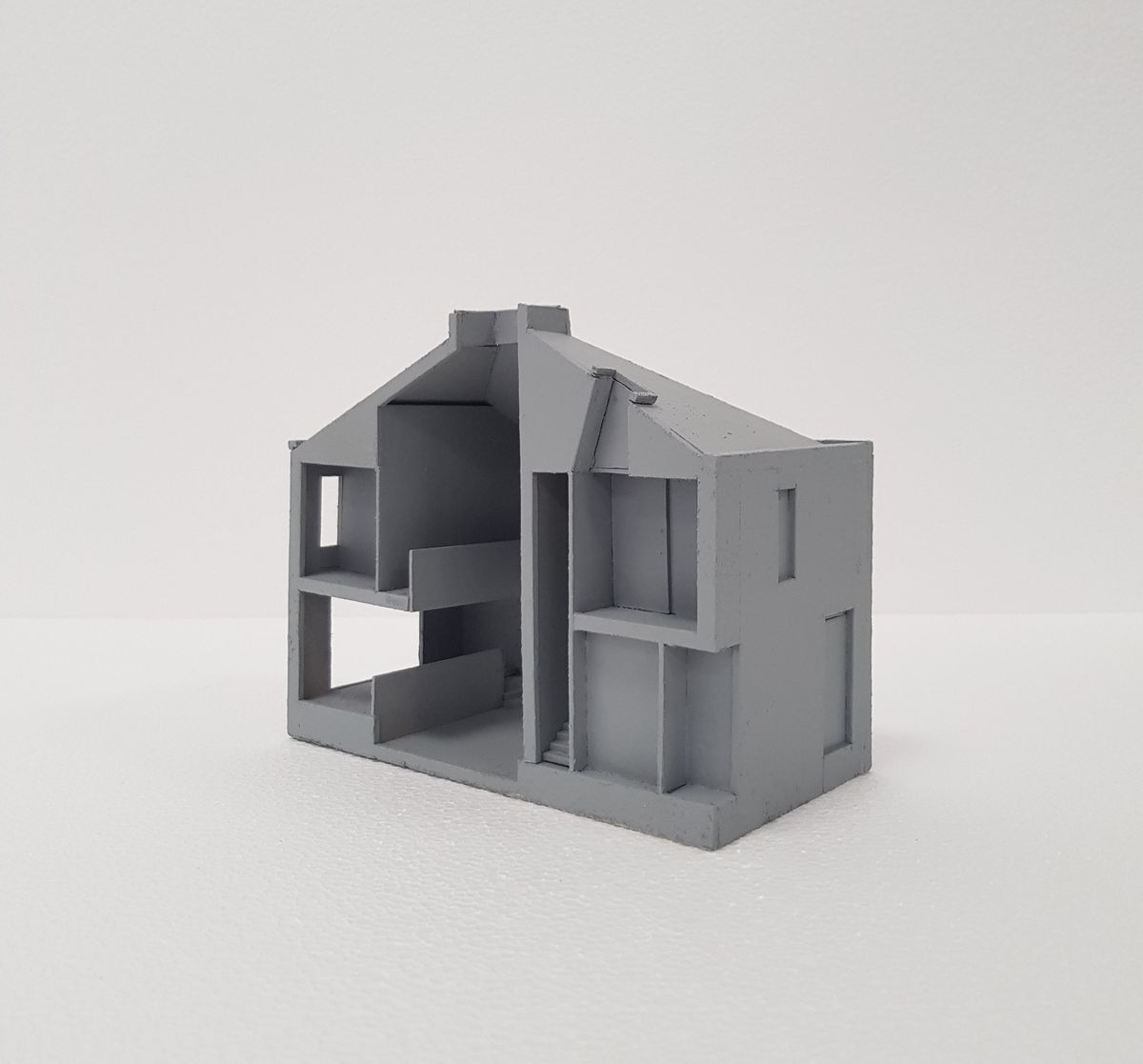 A 3d model of a house with a lightwell in the centre