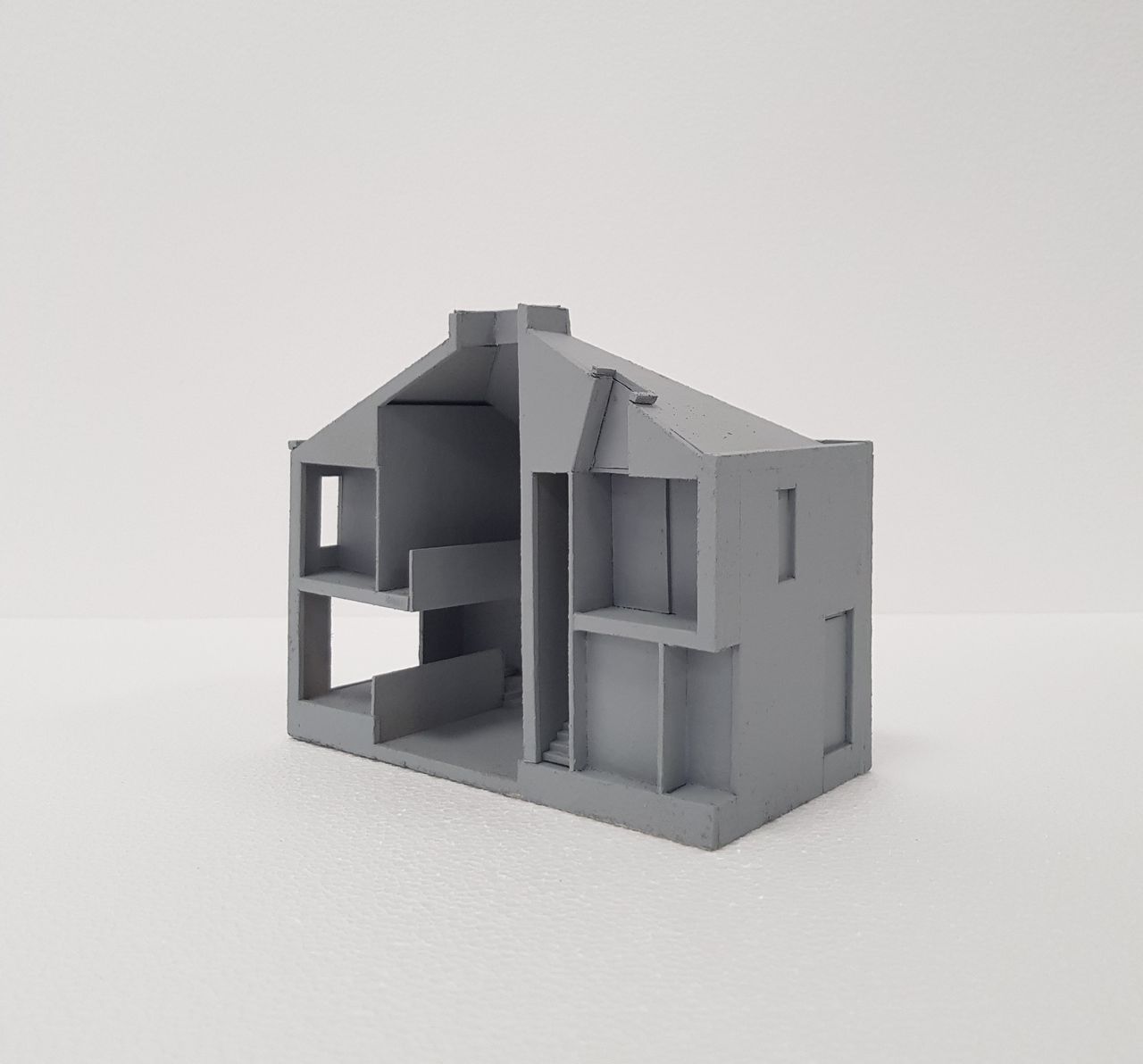 A 3d model of a house with a lightwell in the centre