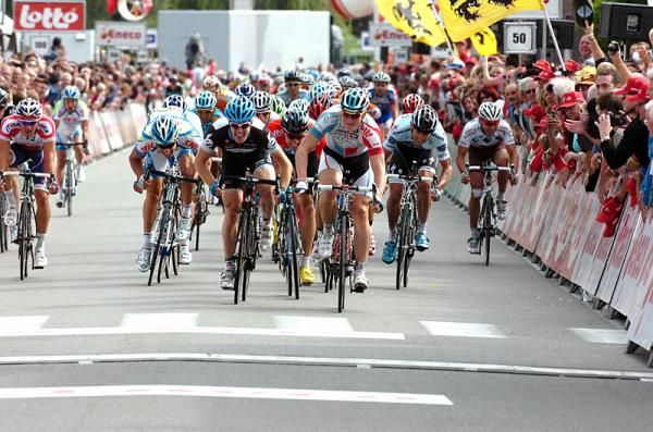 Andre Greipel knows he has stage 2 won and begins to take his hands off the bars in celebration.
