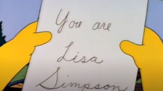 Lisa holding a note in The Simpsons.