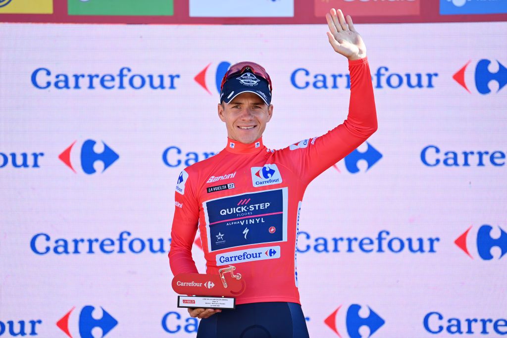 SIERRA DE LA PANDERA SPAIN SEPTEMBER 03 Remco Evenepoel of Belgium and Team QuickStep Alpha Vinyl Red Leader Jersey celebrates at podium during the 77th Tour of Spain 2022 Stage 14 a 1603km stage from Montoro to Sierra de La Pandera 1815m LaVuelta22 WorldTour on September 03 2022 in Sierra de La Pandera Spain Photo by Justin SetterfieldGetty Images