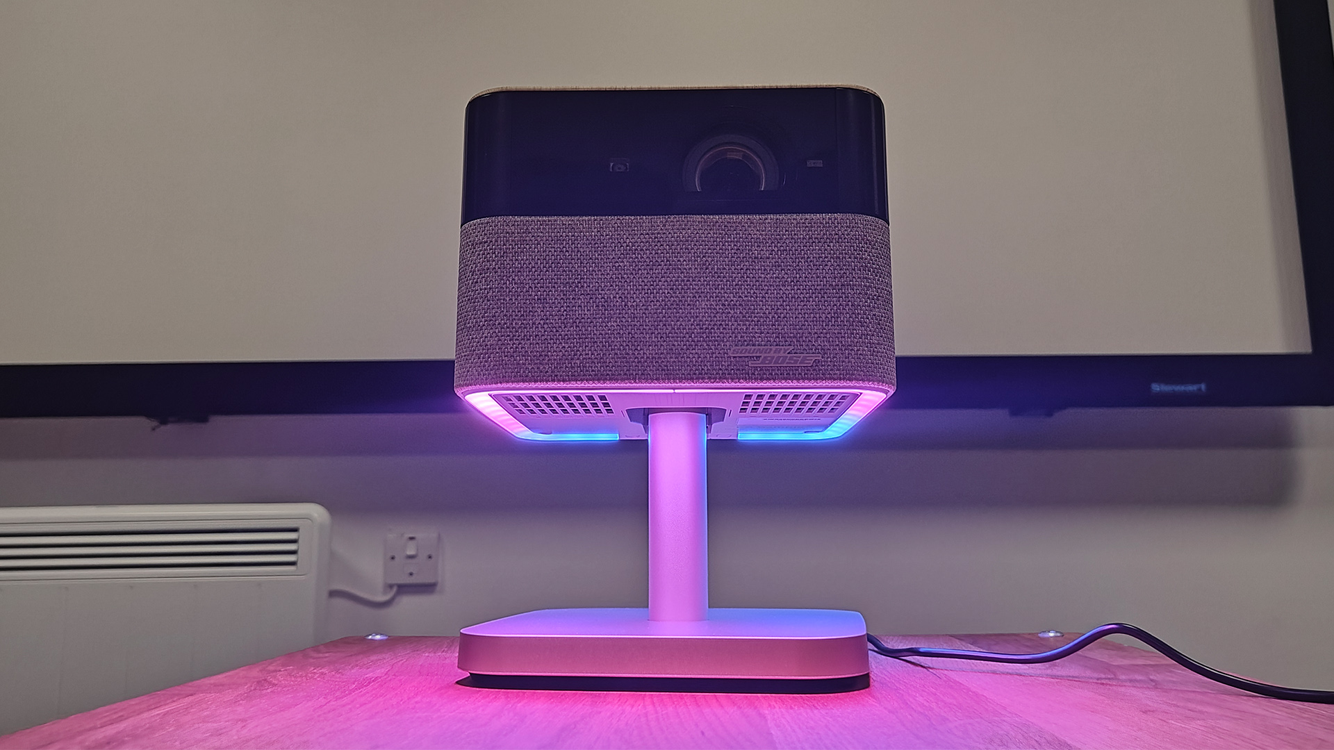 Epson EF-72 home cinema projector showing underside of projector with purple lighting