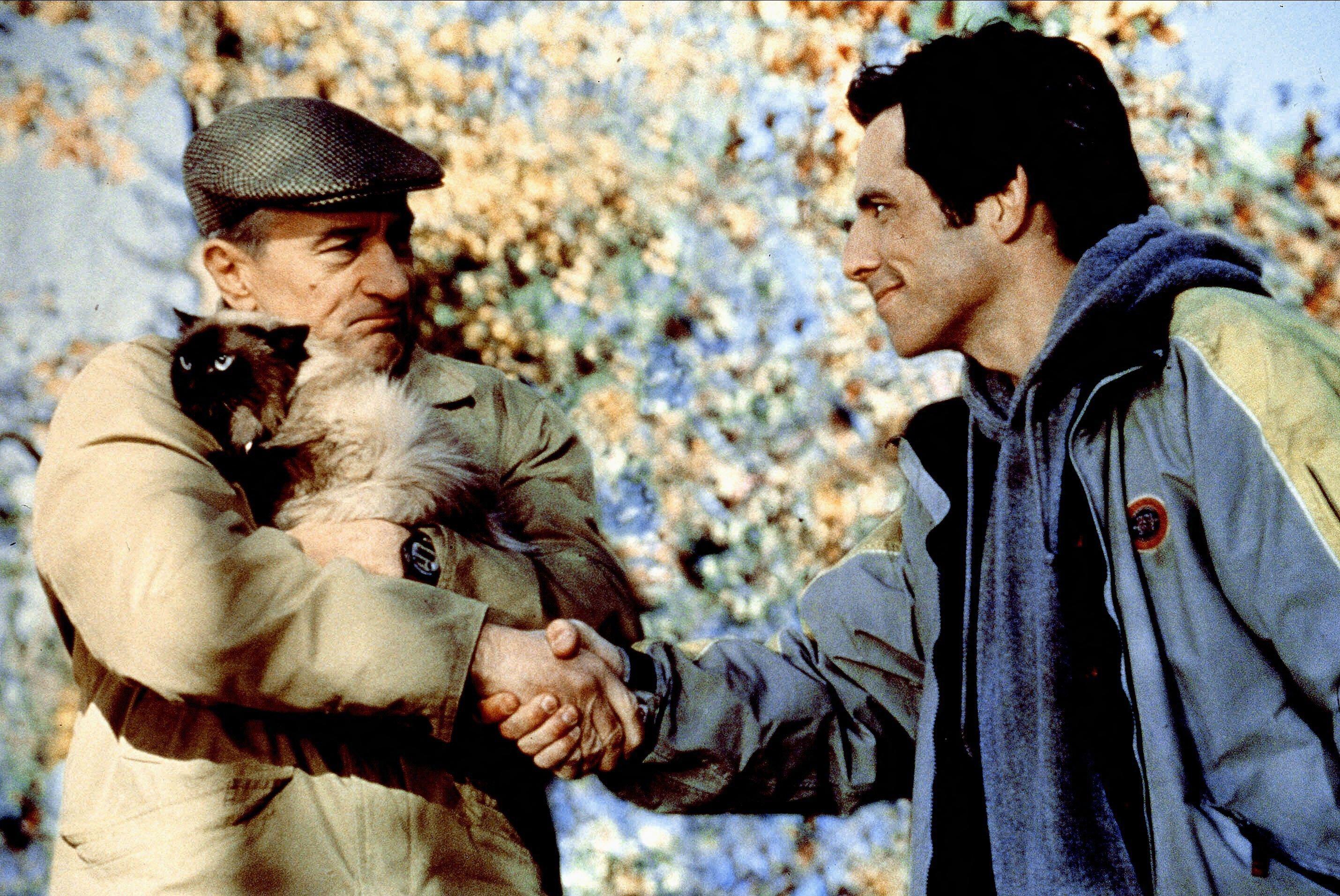 Robert de Niro and Ben Stiller in Meet The Parents, shaking hands