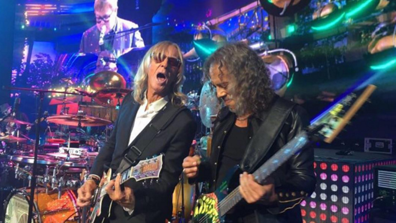 Kirk Hammett onstage with Elton John and Davey Johnstone