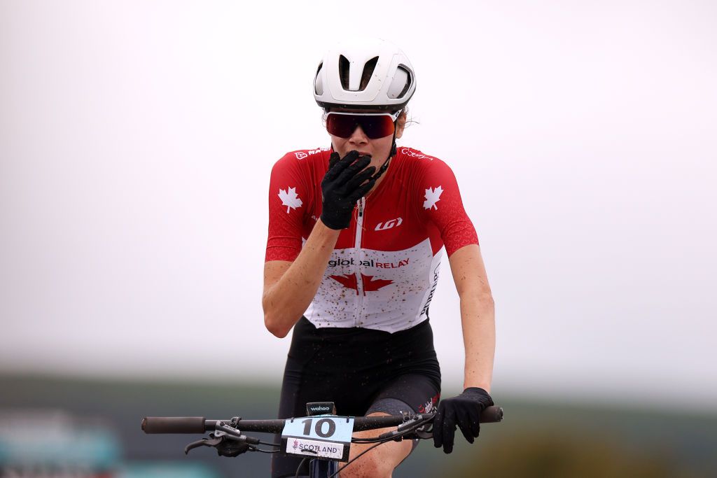 GLENTRESS FOREST PEEBLES SCOTLAND AUGUST 10 Isabella Holmgren of Canada celebrates at finish line as race winner during the Women Junior Crosscountry Olympic at the 96th UCI Cycling World Championships Glasgow 2023 Day 8 UCIWT on August 10 2023 in Glentress Forest Peebles Scotland Photo by Dean MouhtaropoulosGetty Images
