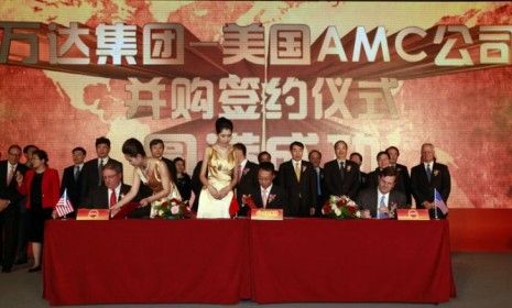 Shareholders and heads of Dalian Wanda Group and AMC meet to announce the Chinese conglomerate&amp;#039;s acquisition of the American theater chain.