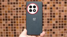 OnePlus 13 in aramid fiber case from back showing red ring