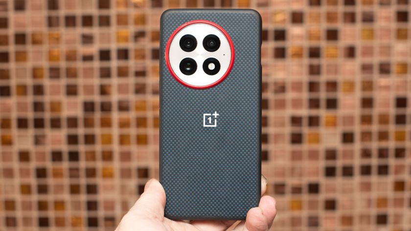 OnePlus 13 in aramid fiber case from back showing red ring