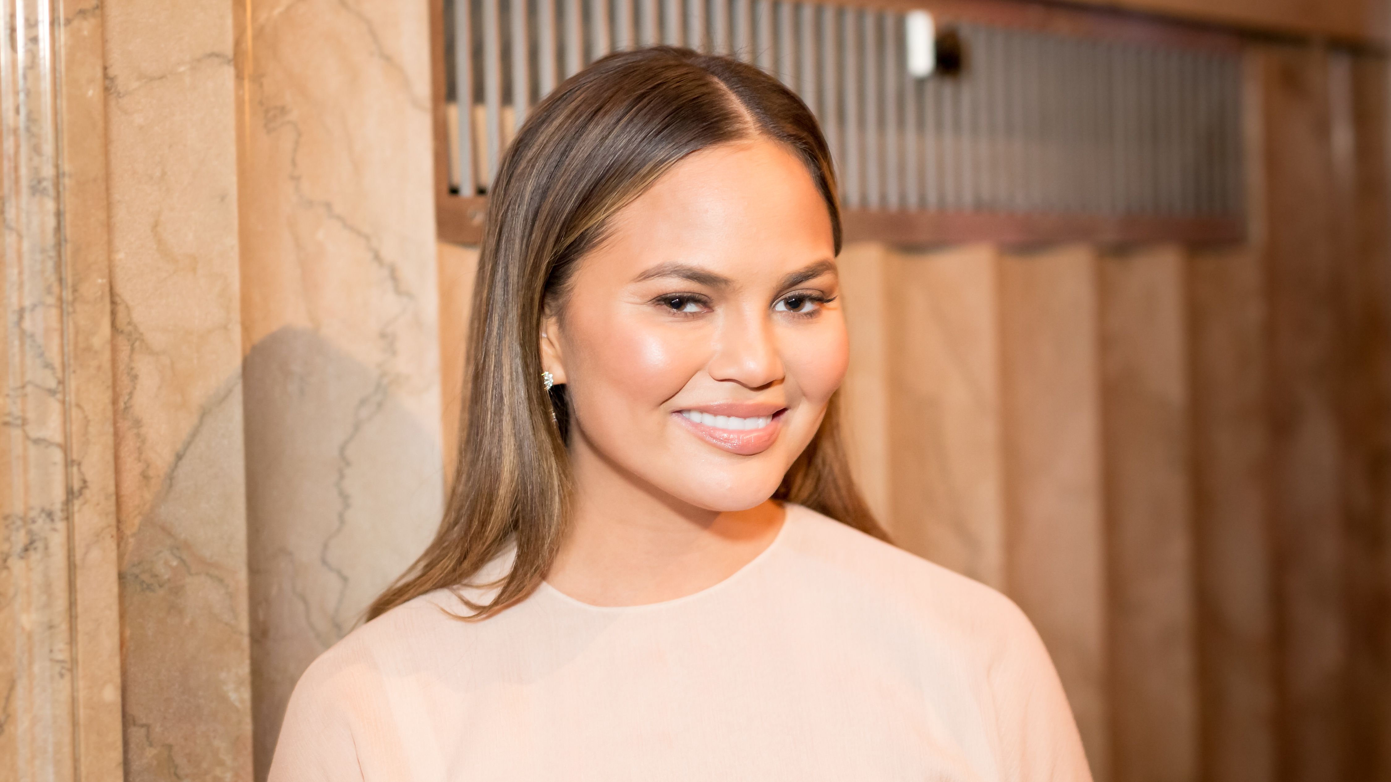 Chrissy Teigen reveals postpartum body in medical mesh underwear