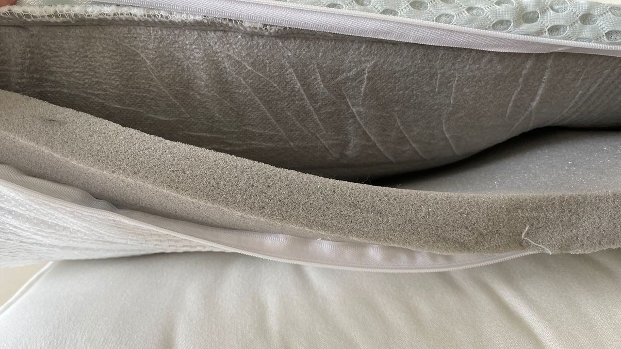 The OTTY Memory Foam Mattress Topper unzipped from the side