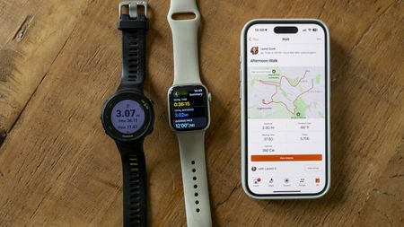 The Strava app on an iPhone 15, Garmin Forerunner 45 and Apple Watch 8 Pro