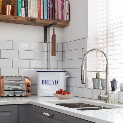 grey kitchen makeover with white metro tiles wood floors and green dining area