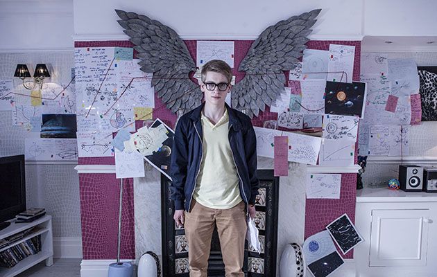 Alfie Nightingale is surrounded by papers and calculations at The Cunningham’s in Hollyoaks.