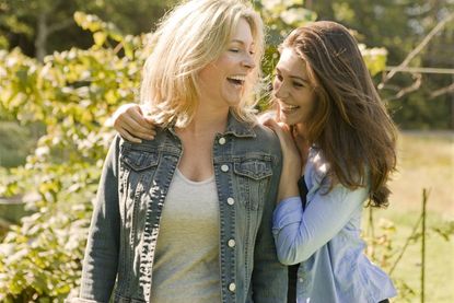 Mother and daughter laughing