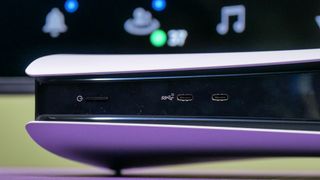 The power button and USB-C ports on the front of a PS5 Pro