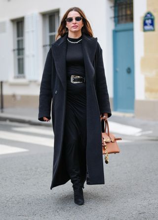 French street style - woman wearing an all-black outfit