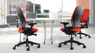 Two steelcase office chairs in light, bright office with lots of windows