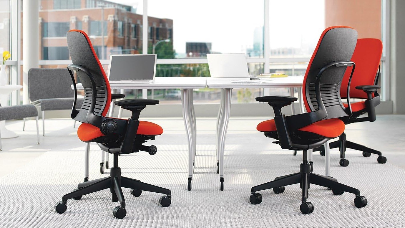 Two Steelcase Leap 2 office chairs in light, bright office with lots of windows