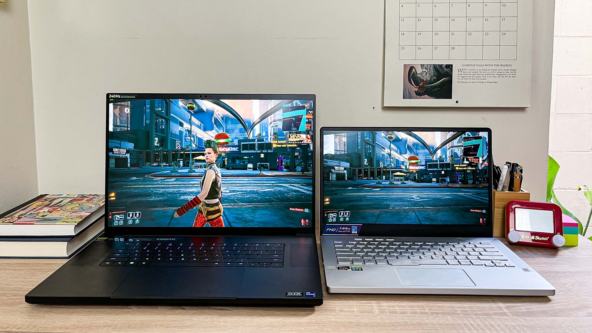 razer Blade 18 running cyberpunk 2077 next to a 14-inch Asus ROG Zephyrus G14 for scale