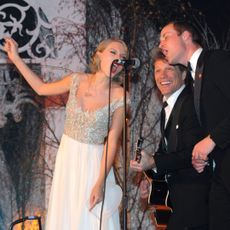 Taylor Swift and Prince William performing on stage with Bon Jovi