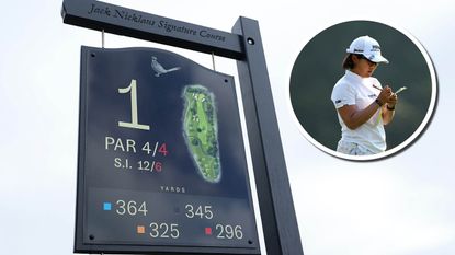 Course information sign and Hataoka reading her yardage book
