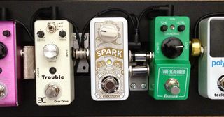 Group of mini pedals on a pedalboard