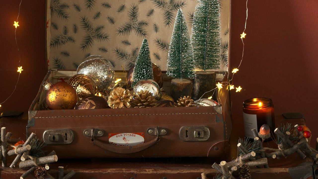 Vintage suitcases filled with Christmas decorations