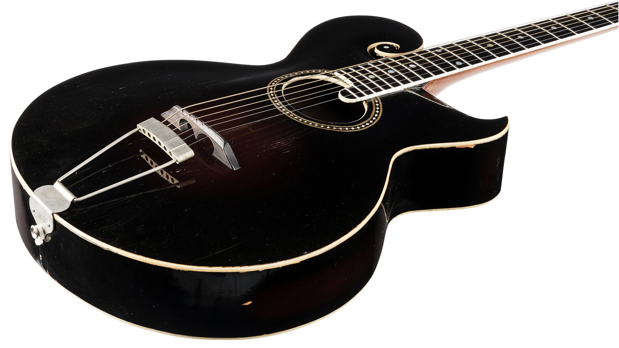 A 1913 Gibson Style O guitar formerly owned by Eric Clapton and George Harrison and used to compose "Badge" and "Here Comes the Sun."