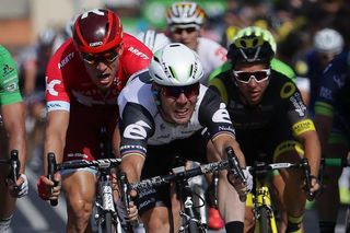 Mark Cavendish throws his bike to win stage 6 at the 2016 Tour de France