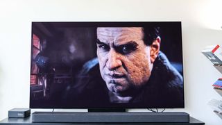 Samsung S90D OLED TV on table in living room