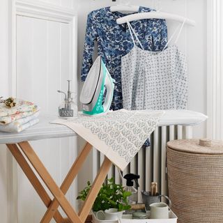 ironing table cloths and white hanger with cloth