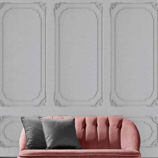 Peel and stick wallpaper grey paneling with pink sofa 