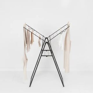 Black clothes rack with two fold out wings