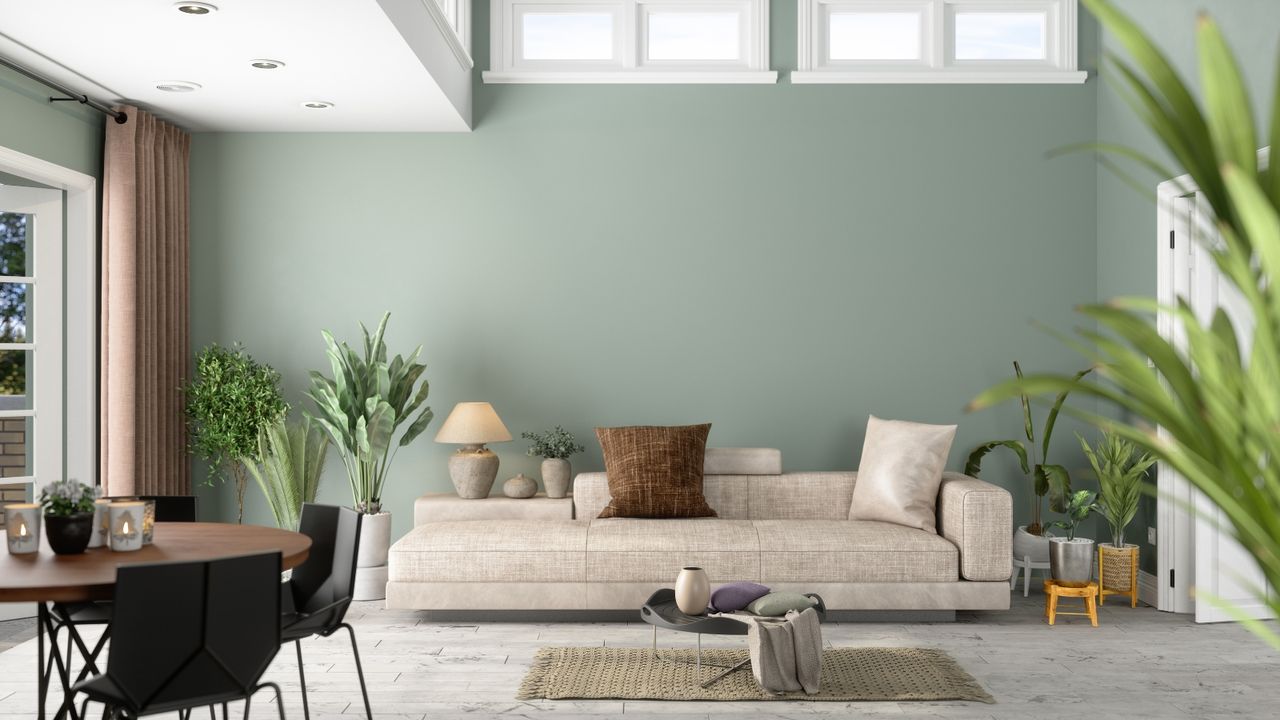 Modern Clean Living Room Interior With Green Plants, Sofa And Green Wall Background