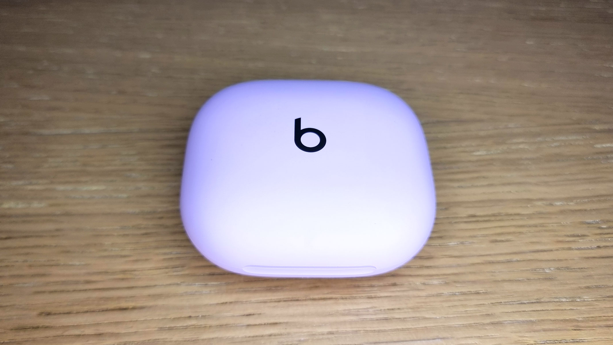 A close-up picture of the charging case for the Beats Powerbeats Fit earbuds