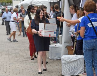 Volunteers load care packages with supplies for troops and vets during the annual 9/11 Service Project on The Rose Kennedy Greenway on September 11, 2018 in Boston, Massachusetts.