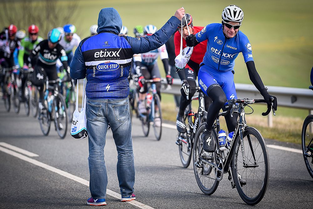 Etixx-QuickStep in the feedzone during stage 1 of Paris-Nice.