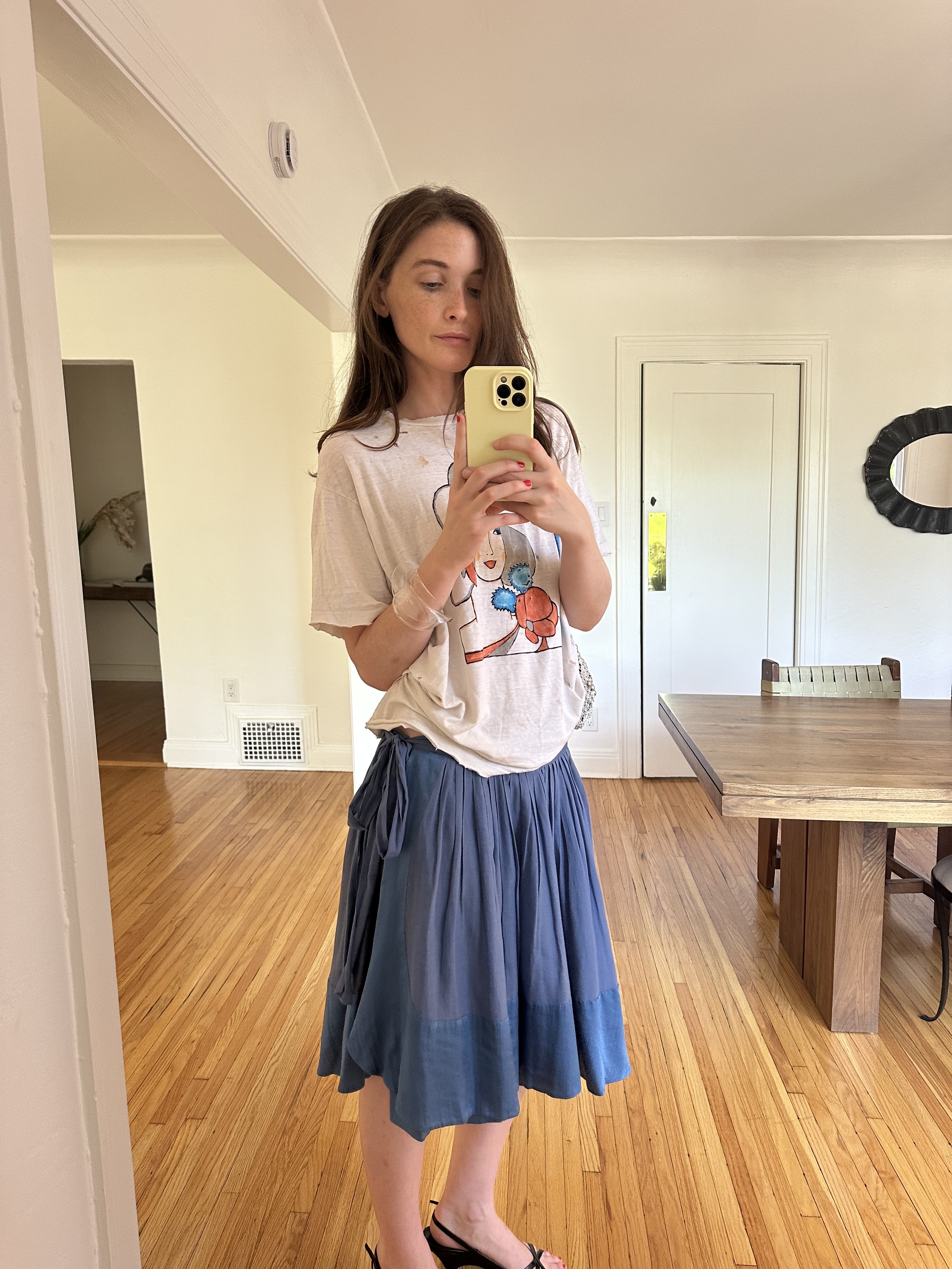Grace O'Neill Dougherty styles a graphic tee with a blue Phoebe Philo skirt and black wedges