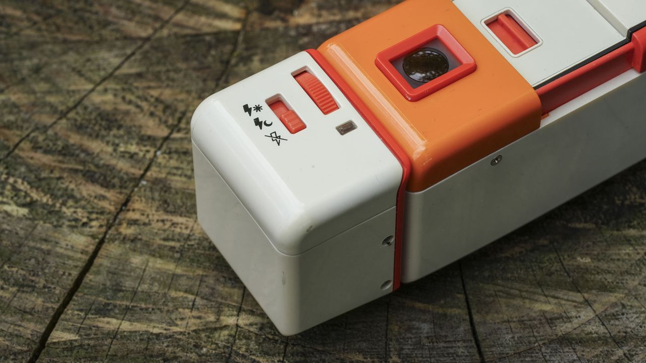 A close up image showing the controls of the Lomography Lomomatic 110 film camera