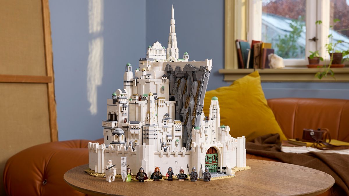 Lego Minas Tirith on a wooden surface, with multiple minifigures visible