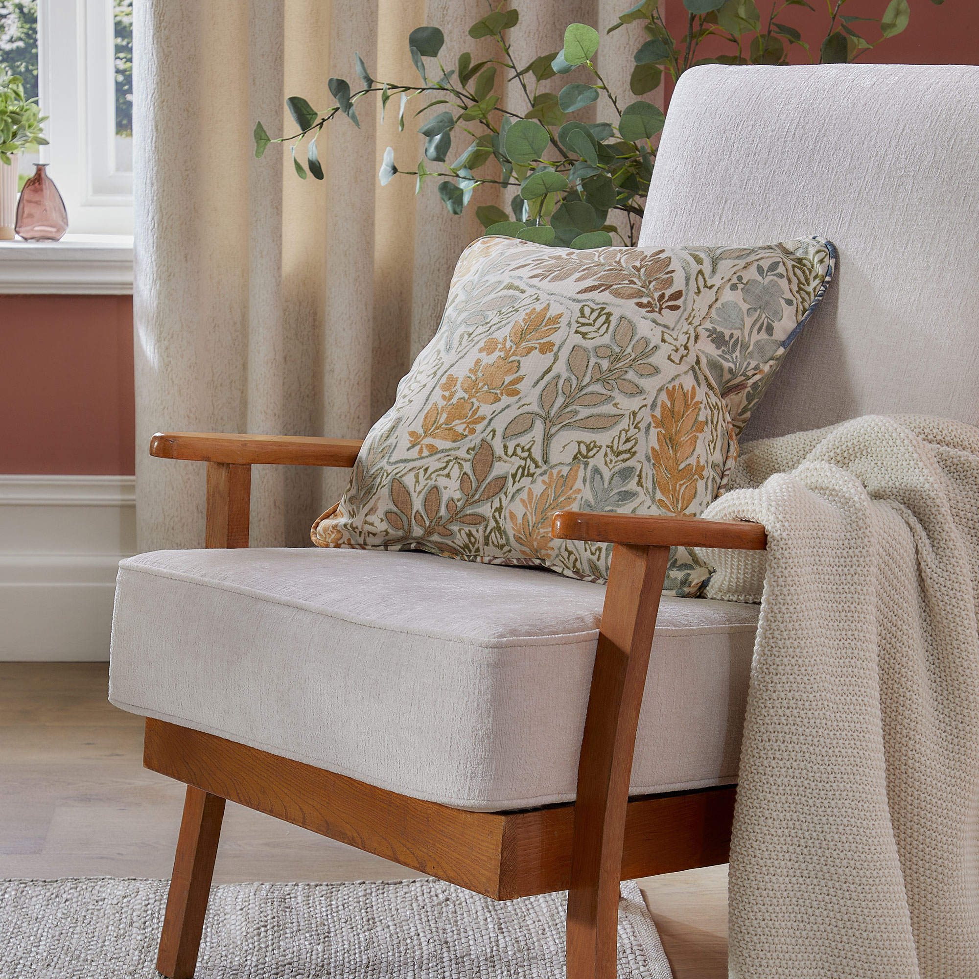 Wooden armchair with white upholstery