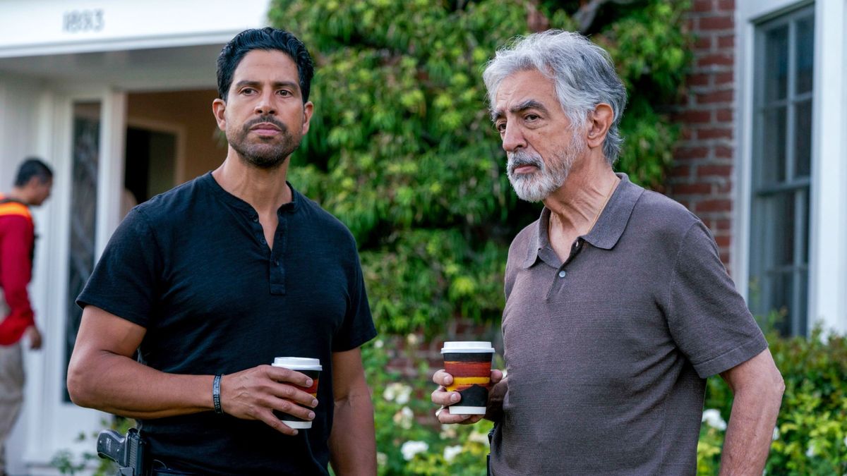 Adam Rodriguez and Joe Mantegna stand with coffee cups at a crime scene in Criminal Minds: Evolution