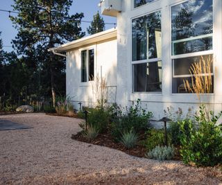 front yard landscaping with gravel, mulch, plants and rocks