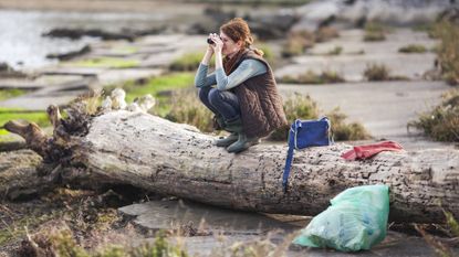 best monocular: Woman Collecting Garbage and Watching Environment With Monocular