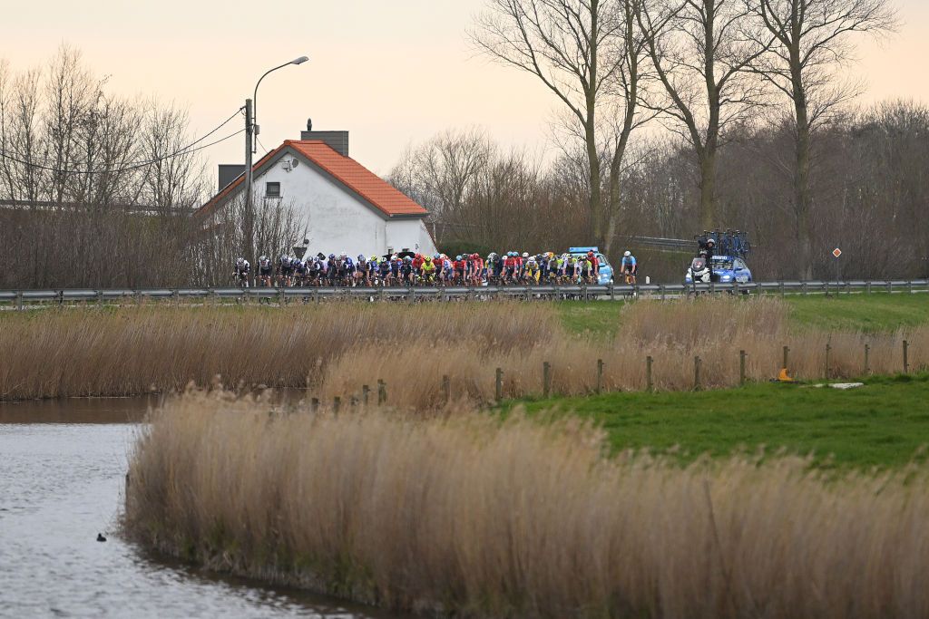 KOKSIJDE BELGIUM MARCH 17 A general view of the peloton passing through a landscape during the 21th Bredene Koksijde Classic 2023 a 1916km one day race from Bredene to Koksijde on March 17 2023 in Koksijde Belgium Photo by Luc ClaessenGetty Images