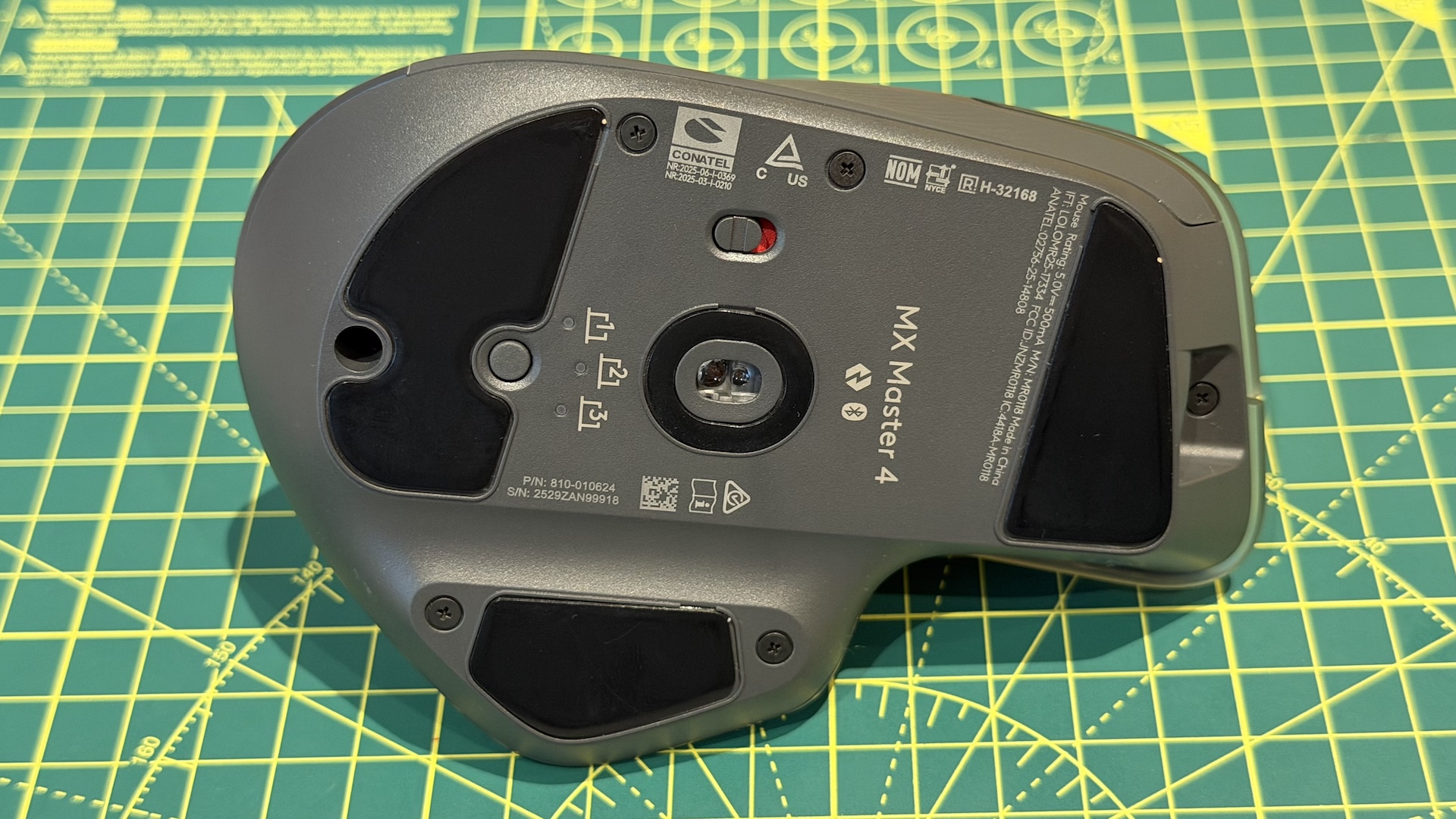 The Logitech MX Master 4 mouse on a graphing grid