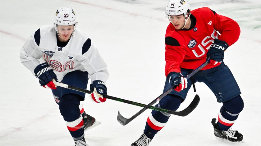 Jake Guentzel #59 and teammate Brock Faber #14 of the United States skate against each other at practice during media day ahead of the 2025 NHL 4 Nations Face-Off