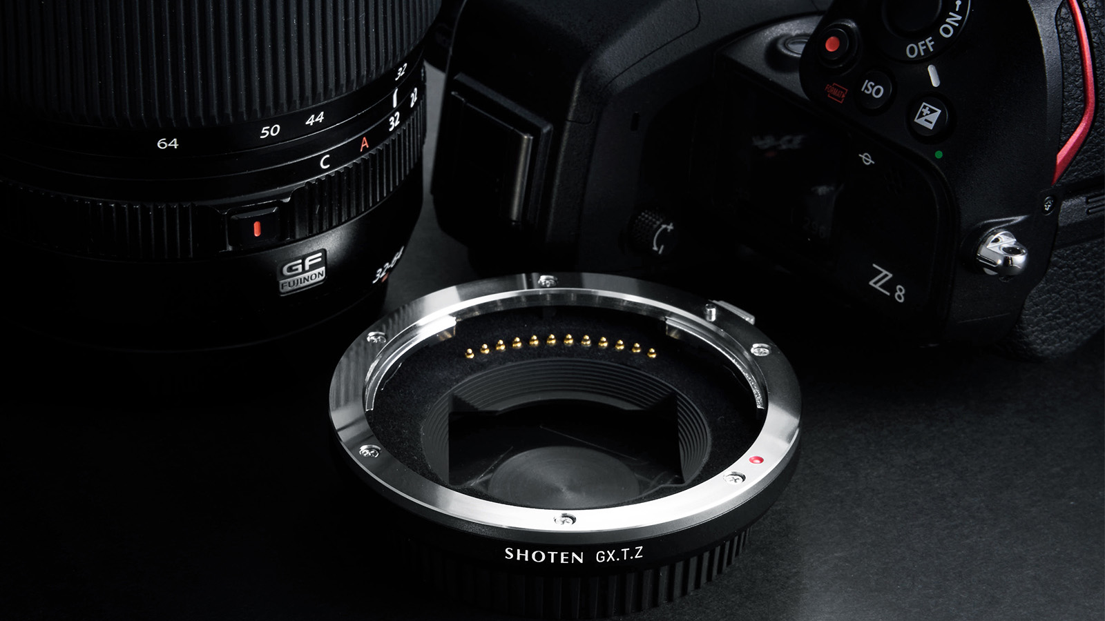 Shoten Mount Adapter GXTZ next to GF lens and a Nikon camera